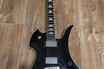A great korean B.C.Rich Special 2008. Nice sound,sweet guitar,great specs:neck-thru,ebony fingerboard,
mahagony body with a maple arched top,Grover tuners and bridge,2 Rockfield SWV Pickups , 24-3/4" Scale .
A one of the best axes ever for money.
SOLD.